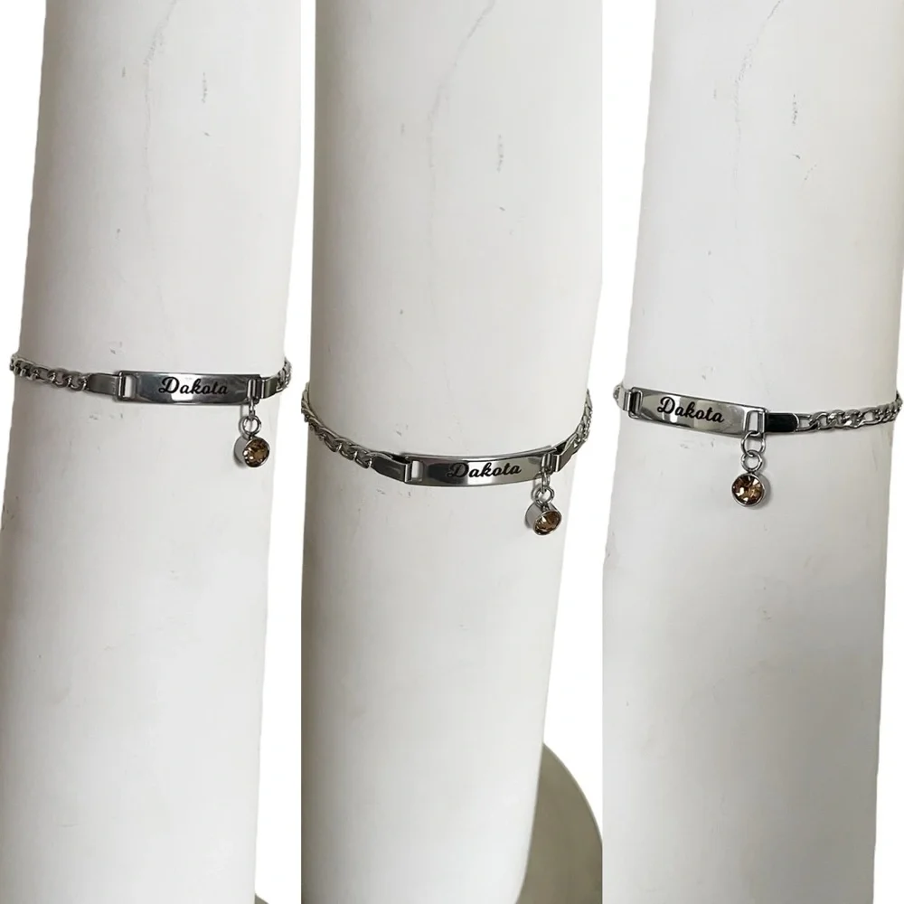 “Dakota” Baby/ Kid’s Silver Metal Name Bracelet with Orange Rhinestone Charm